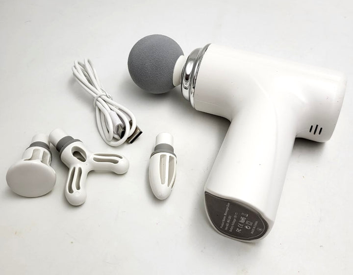 Mini Massage Gun white with four interchangeable massage heads and USB cable