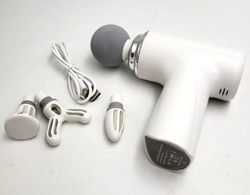 Mini Massage Gun white with four interchangeable massage heads and USB cable